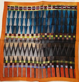 Geometric patterned fabric with triangles and stripes on an orange background